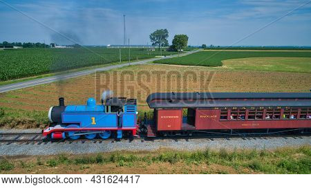 Ronks, Pennsylvania, June 2019 - Aerial View Of Thomas The Tank Engine Approaching Pulling Passenger