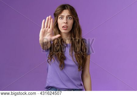 Worried Shocked Curly-haired Woman Gasping Stare Camera Anxiously Pull Hand Stop Sign Begging End Pr