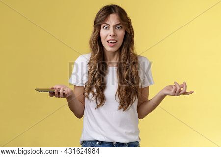 Pissed Frustrated Bothered Curly-haired Caucasian Girl Stare Camera Puzzled Complain Hold Smartphone