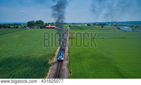 Ronks, Pennsylvania,june 2019 - Aerial Head On View Of Thomas The Tank Engine Approaching Thru Trees