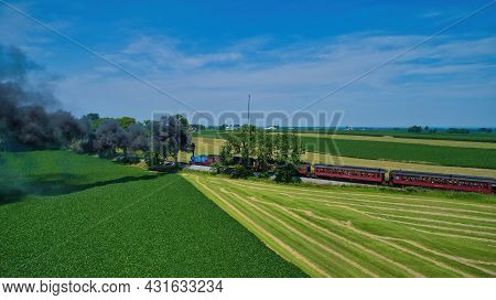 Ronks, Pennsylvania,june 2019 - Aerial View Of Thomas The Tank Engine Approaching Thru Trees And Far