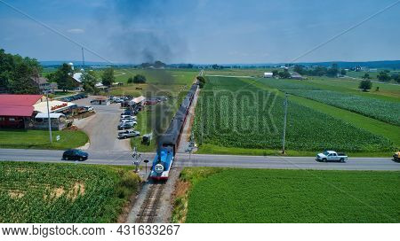 Ronks, Pennsylvania,june 2019 - Aerial Head On View Of Thomas The Tank Engine Approaching Thru Trees
