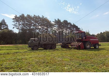 Combine Harvesting A Green Field