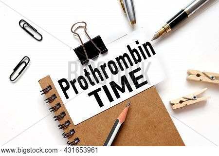 Prothrombin Time, Text On White Sticker On Light Table.