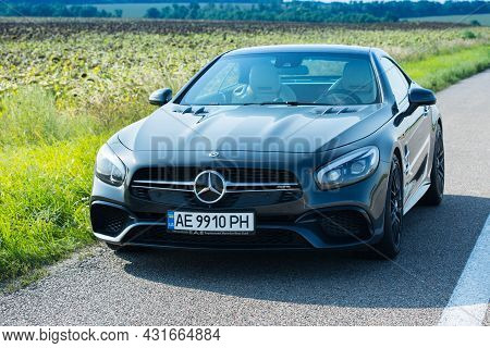 Dnepropetrovsk, Ukraine - 08.24. 2021: Photos Of The Mercedes Benz Sl550 Convertible On The Road.