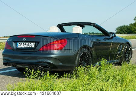 Dnepropetrovsk, Ukraine - 08.24. 2021: Photos Of The Mercedes Benz Sl550 Convertible On The Road.