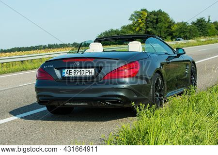 Dnepropetrovsk, Ukraine - 08.24. 2021: Photos Of The Mercedes Benz Sl550 Convertible On The Road.