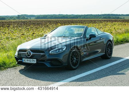 Dnepropetrovsk, Ukraine - 08.24. 2021: Photos Of The Mercedes Benz Sl550 Convertible On The Road.