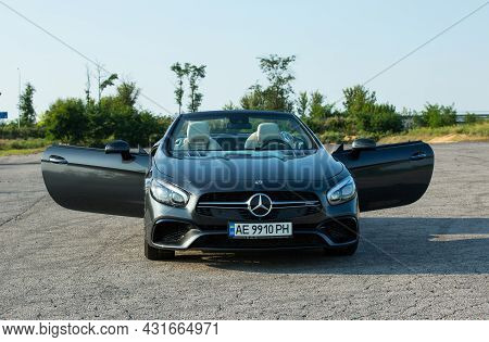 Dnepropetrovsk, Ukraine - 08.24. 2021: Photos Of The Mercedes Benz Sl550 Convertible On The Road.