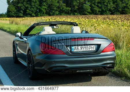 Dnepropetrovsk, Ukraine - 08.24. 2021: Photos Of The Mercedes Benz Sl550 Convertible On The Road.