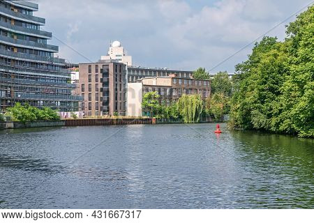 Berlin, Germany - July 3, 2021: Bank Of The River Spree Schleswiger Ufer With Recently Erected Build