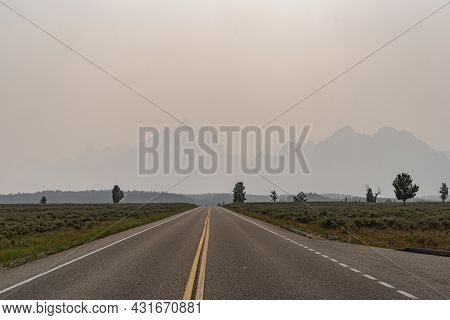 Hazy Smoke In The Air From Nearby Summer Wildfires In The Grand Teton National Park In Wyoming. Poor