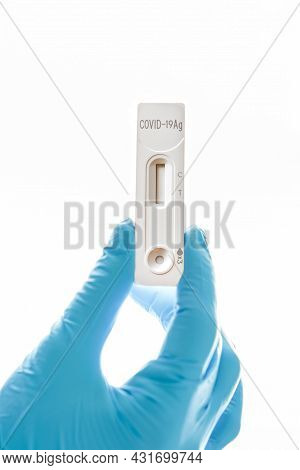 Hand In A Glove Holding Rapid Serology Antigen Covid-19 Test Show Invalid Result Of Coronavirus, Ant