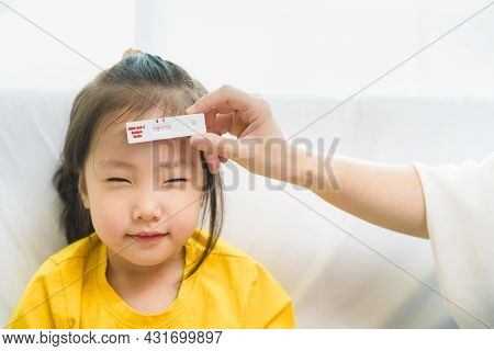 Adorable Kid Toddler Show Her Result Test That Holding By Parent Hand, Rapid Test Kit That Appear Ne