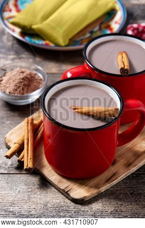 Traditional Mexican Chocolate Atole Drink On Wooden Table