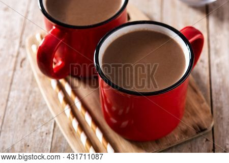 Traditional Mexican Chocolate Atole Drink On Wooden Table