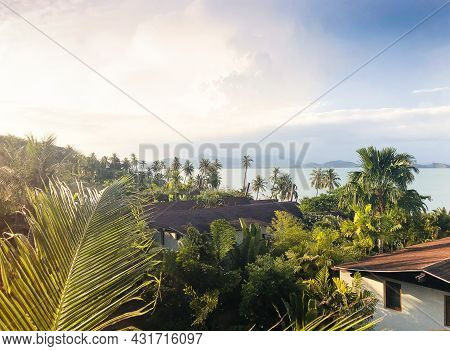 Aerial View Of Red Roofs Of Houses, Palms And Ocean. Tropical Landscape On Island. Clouds And Blue S