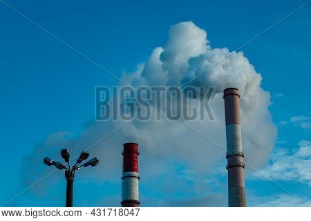 Smoking Chimneys Of Factories. Pollution Of The Atmosphere By Emissions And Carbon Dioxide. Harmful 