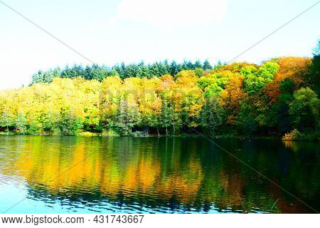 Caldera Lake Holzmaar Near Gillenfeld In Autumn Colors With Reflection In The Lake