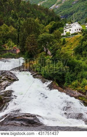 Hellesylt Fossen waterfall in the area Geirangerfjord in village Hellesylt