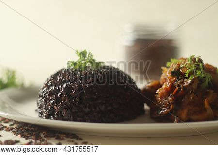 Black Rice Pulao. A One Pot Rice Preparation With Black Rice, Ghee And Spices. Served With Chicken R