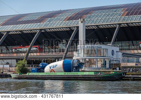 Amsterdam, Netherlands - August 15, 2021: Blue-white Cement Mill Installed On Barge Docked Along Qua