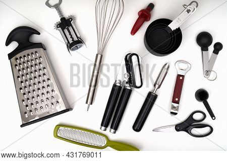 Photograph Of A Kitchen Drawer Filled With An Assortment Of Utensils