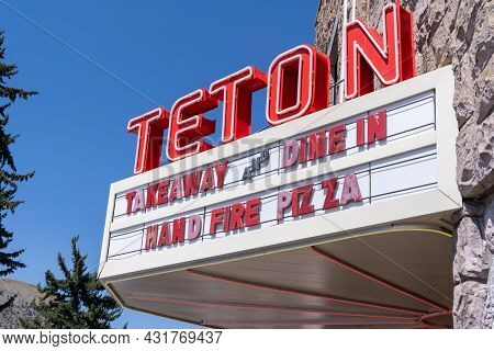 Jackson, Wyoming - August 9, 2021: Old Fashioned Neon Sign For The Teton Movie Theater, Now A Pizzar