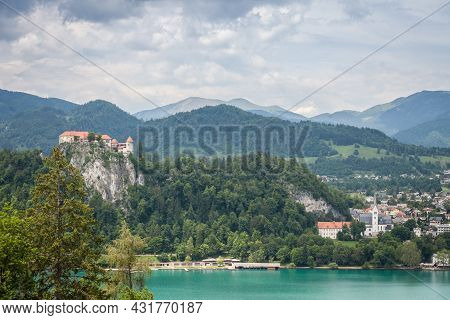 Panorama Of The Bled Lake, Blejsko Jezero, With Its Castle, Blejski Hrad, During A Cloudy Summer Wit