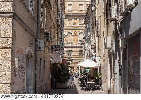 Rijeka, Croatia - July 18, 2021: Narrow Street Of Stari Grad, The Old Town Of Rijeka, With Decaying 