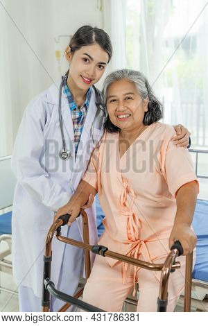The Old Woman Was Raising Herself Up With A Four-legged Walking Aid By Her Side , There Was A Doctor