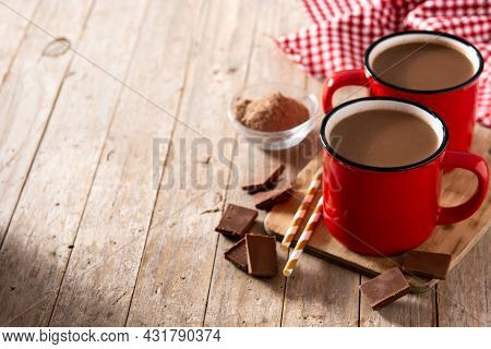Traditional Mexican Chocolate Atole Drink On Wooden Table. Copy Space