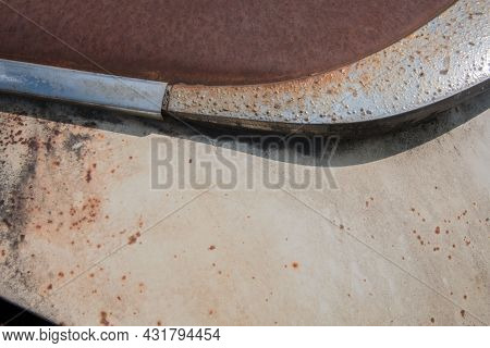 Partial View Of The Front Of An Old Rusty Car