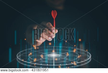 Businessman Throwing Red Arrow Dart To Virtual Target Dart Board. Setup Objectives And Target For Bu