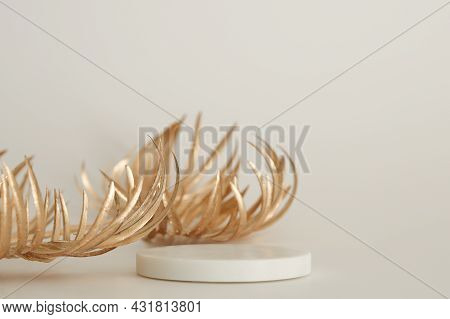 Marble Podium With Golden Leaves On The White Background. Podium For Product, Cosmetic Presentation.