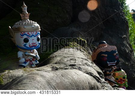 Ravana, Giantess And Hanuman. Standing On The Base Of A Large Tree At The Park. Traveller Doll.
