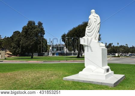 SAN PEDRO, CALIFORNIA - 27 AUG 2021: Closeup of the Juan Rodriguez Cabrillo Statue and Cabrillo Marine Aquarium.
