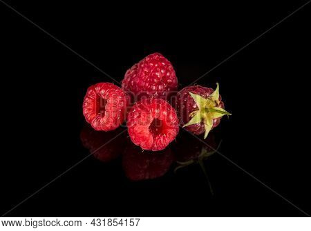 Raspberry Isolated. Raspberries With Leaf Isolate. Raspberry With Leaf Isolated On Black Background.