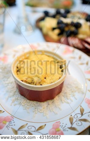 Chicken And Cheese Julienne In A Cocotte-ramequin On The Festive Table.