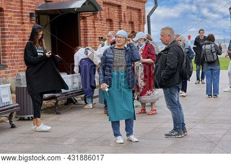 Saint Petersburg, Russia - July 12, 2021: A Group Of Religious Pilgrims Prepares To Visit The Koneve