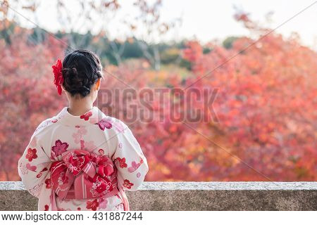 Young Woman Tourist Wearing Kimono Enjoying With Colorful Leaves In Kiyomizu Dera Temple, Kyoto, Jap