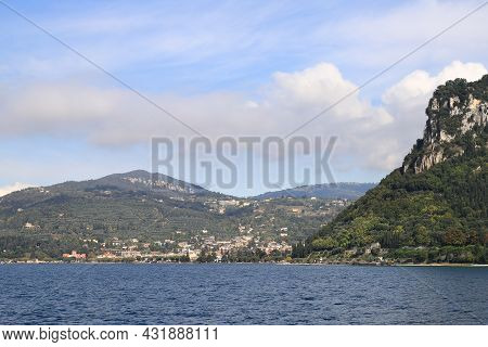 The View From Bardelino Around The Rocca Di Garda Headland Towards Garda.  Garda Is A Resort Town On