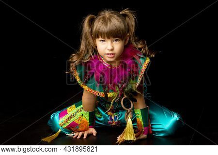 Pretty Little Girl Crawling On Floor. Portrait Of Beautiful Preteen Girl Dressed Bright Ethnic Costu