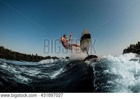 Man Rider Falls From Foil Board Into Splashing River Wave