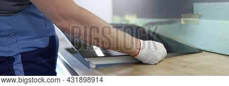 Master Installs Electric Hob On Kitchen Cabinet