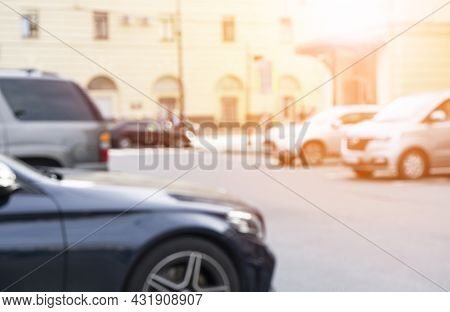Blurred Background With Cars On The Strret. Bokeh Lights Background. Abstract Blur Car Parking Lot F