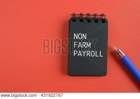 Pen And Notebook Written With Text Non Farm Payroll