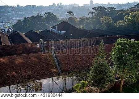 Panoramic View On Old Part Of Porto And Porto Loges Of Vila Nova De Gaia In Portugal At Sunrise