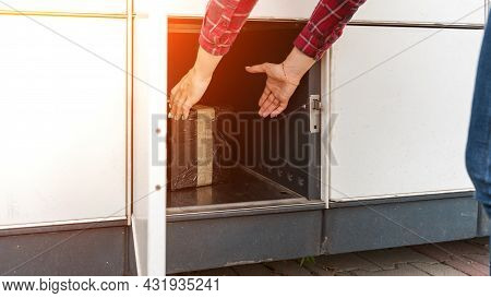Post Locker. Delivery Automat Terminal And Hands With Parcel Courier Box. Parcel Delivery, Pickup Po