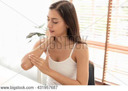 Close Up And Slow Motion Shot. Caucasian Woman Applying Elbow Cream, Lotion. Young Female Do Daily B